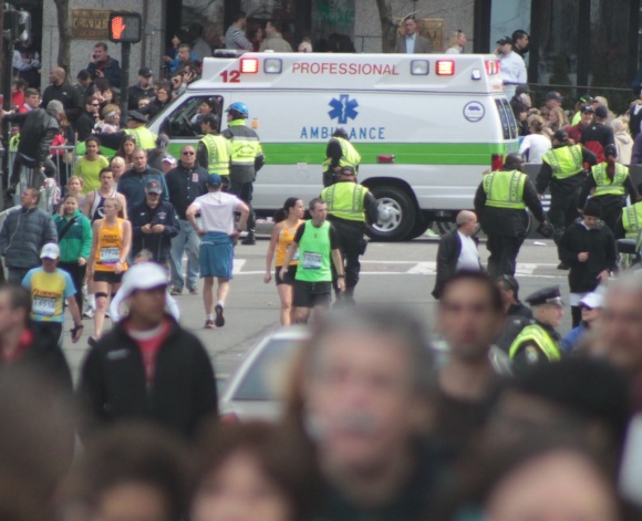 One of the first ambulances moves down Boylston Street toward the finish line.